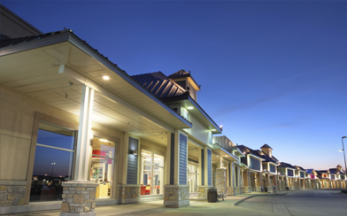 Long Building in the early evening with lights on outside