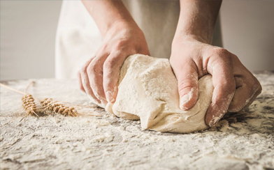 Hands Kneading Bread